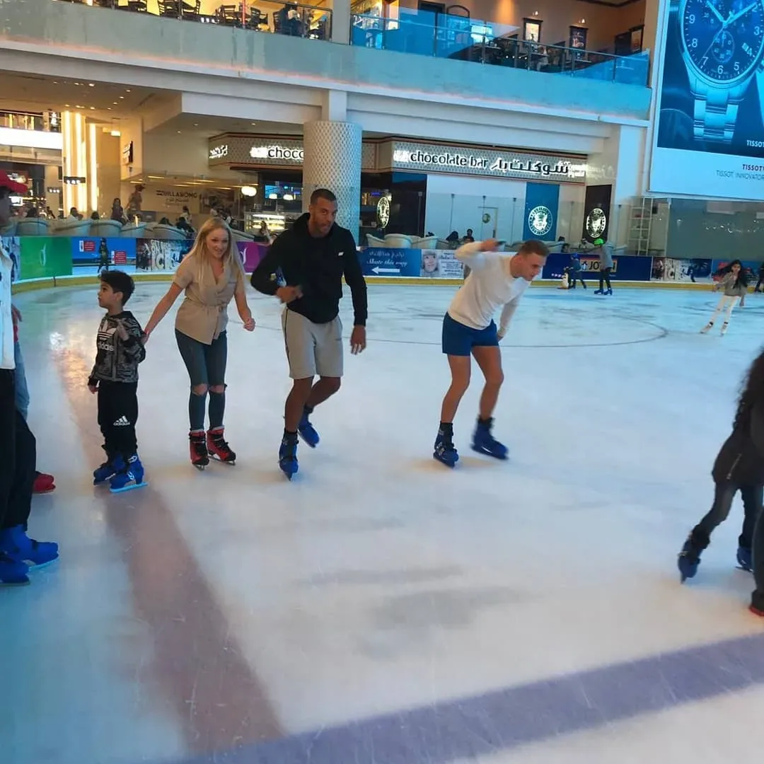 Dubai Ice Rink with family and visitors enjoying ice skating inside Dubai Mall