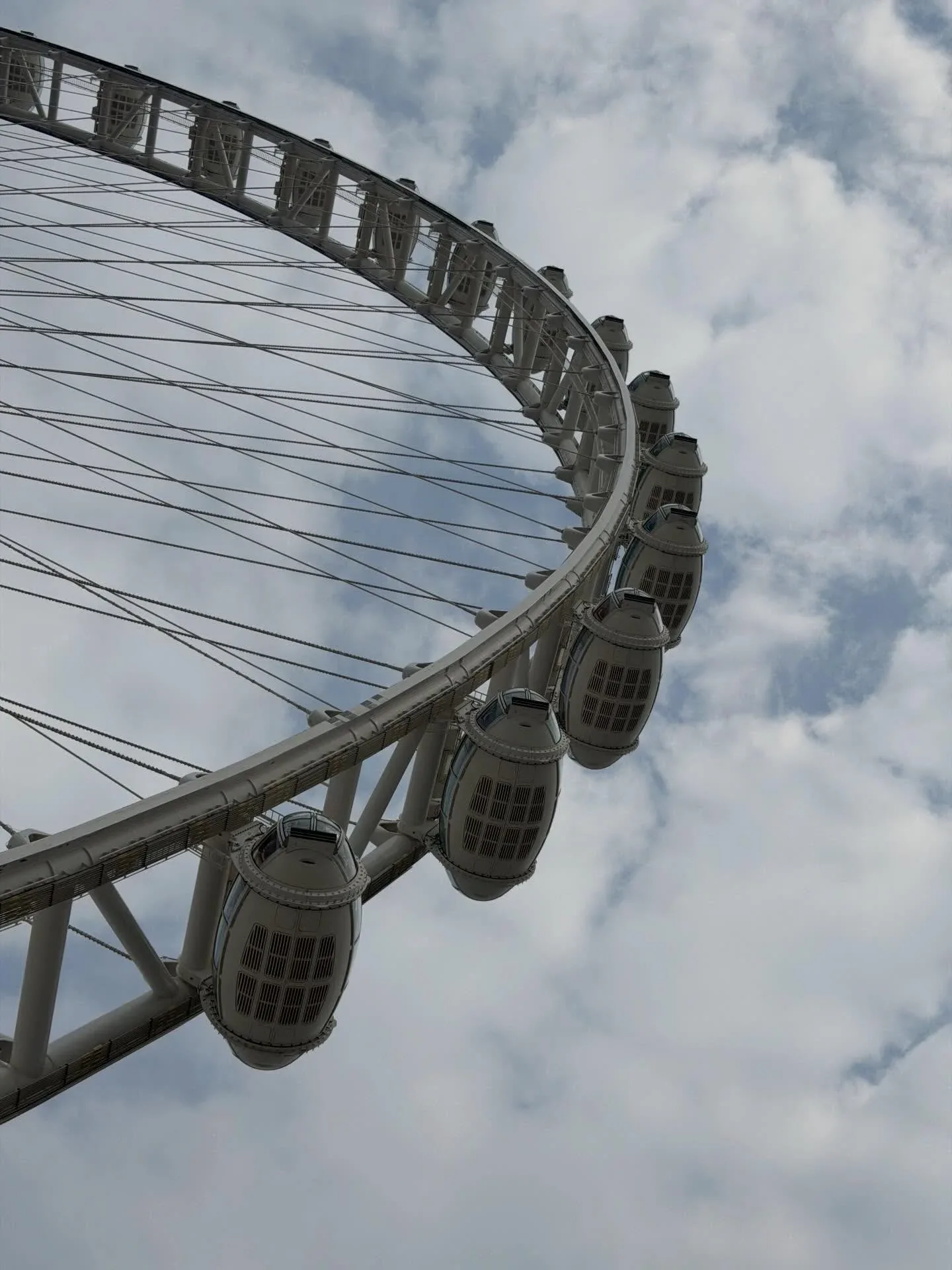 Ain Dubai Observation Wheel cabins and support structure against cloudy sky