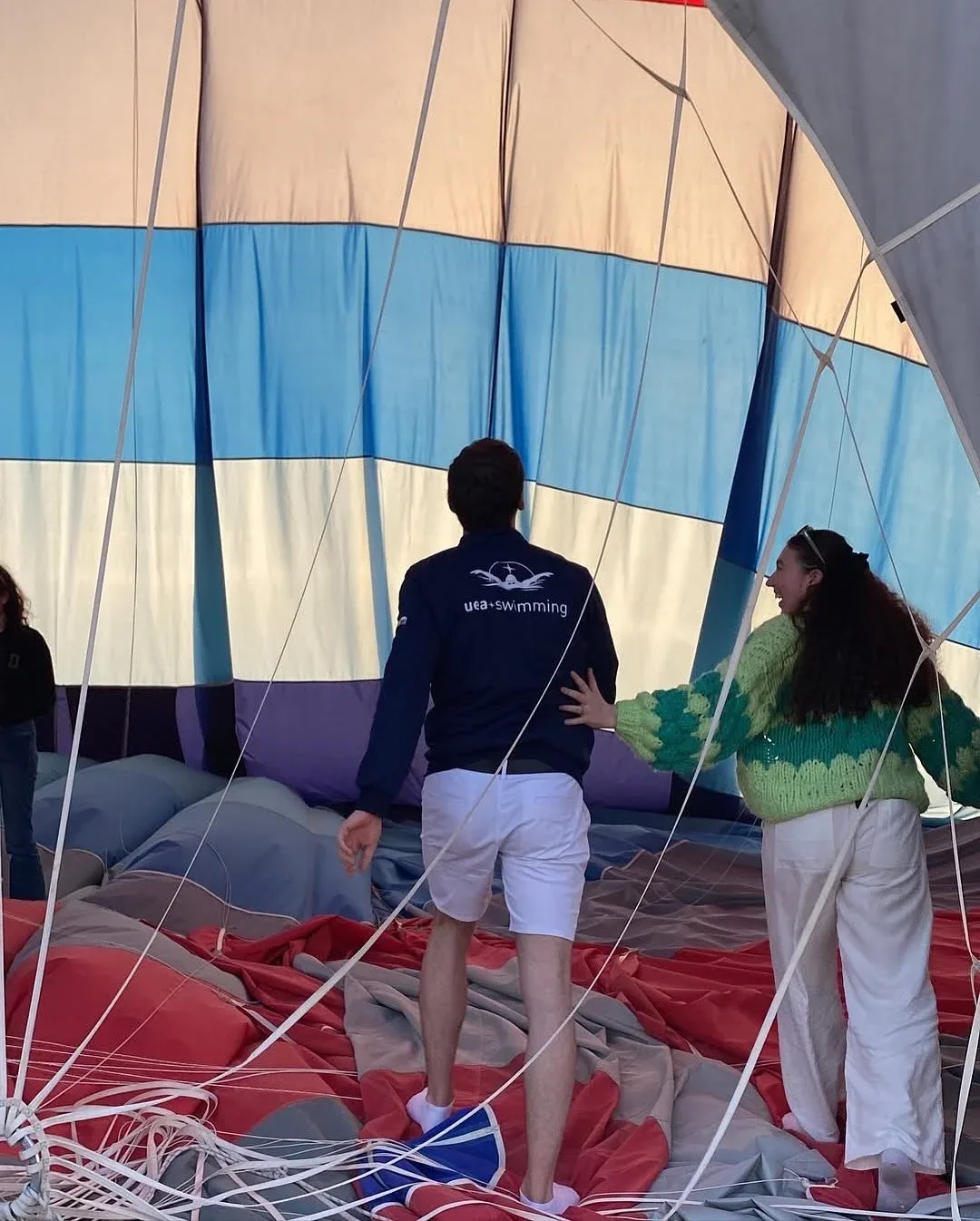 Passengers preparing for a hot air balloon flight inside the balloon basket