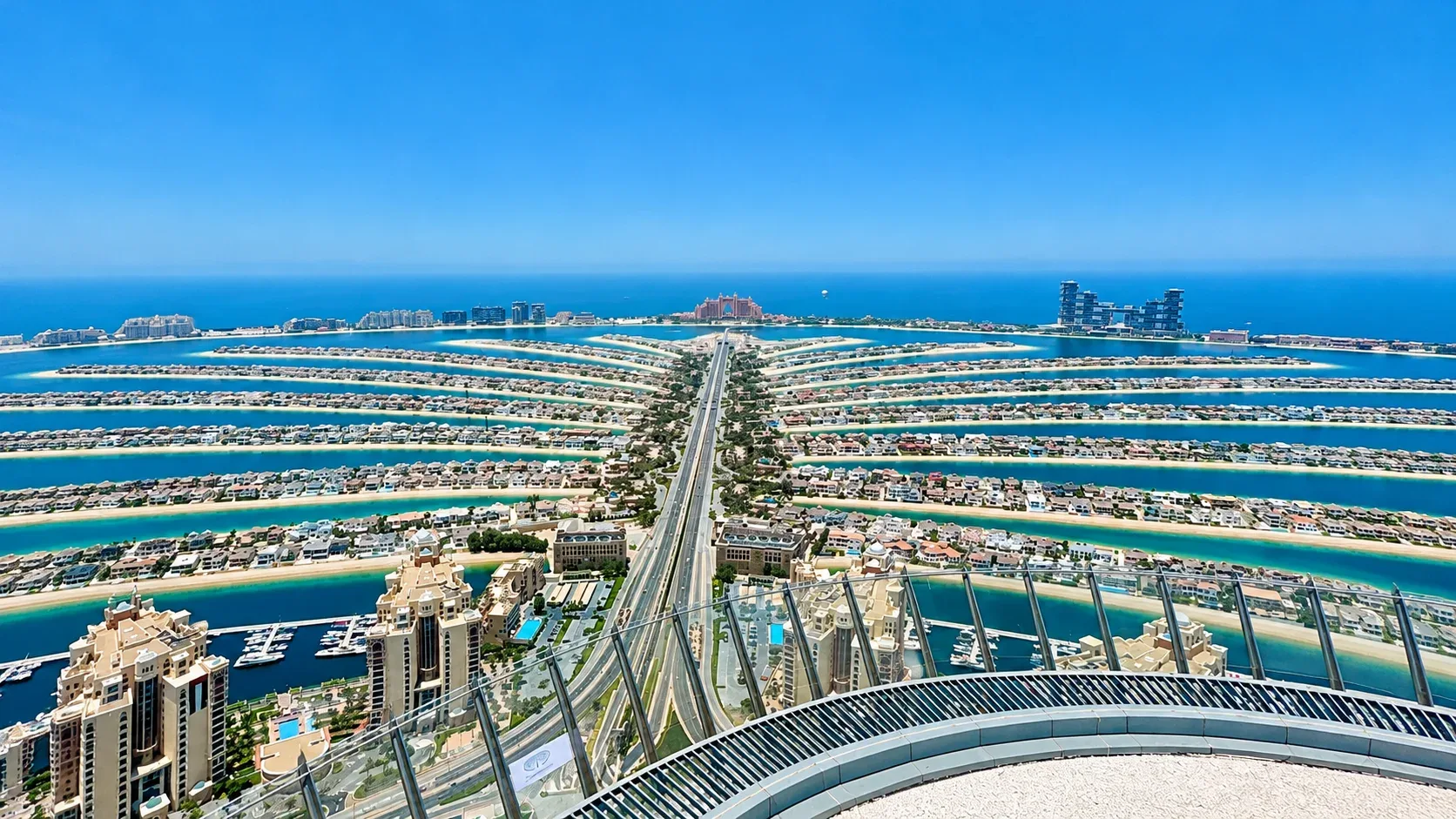 Aerial panoramic view of Palm Jumeirah Dubai with turquoise waters and luxury waterfront residences