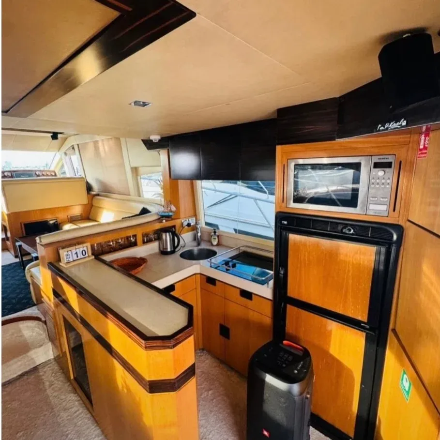 Modern kitchen and dining area inside a luxury private charter yacht in Dubai