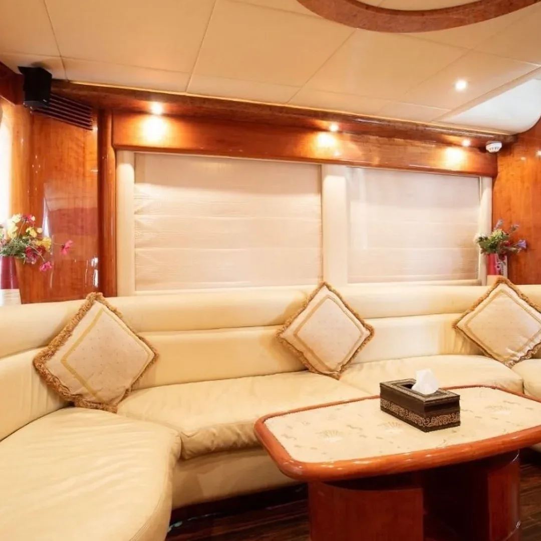 Comfortable seating and dining area inside a Bristol private charter yacht