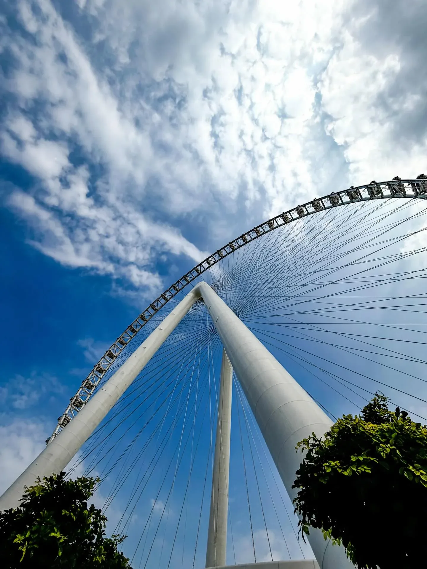Ain Dubai Observation Wheel viewed from below against blue sky