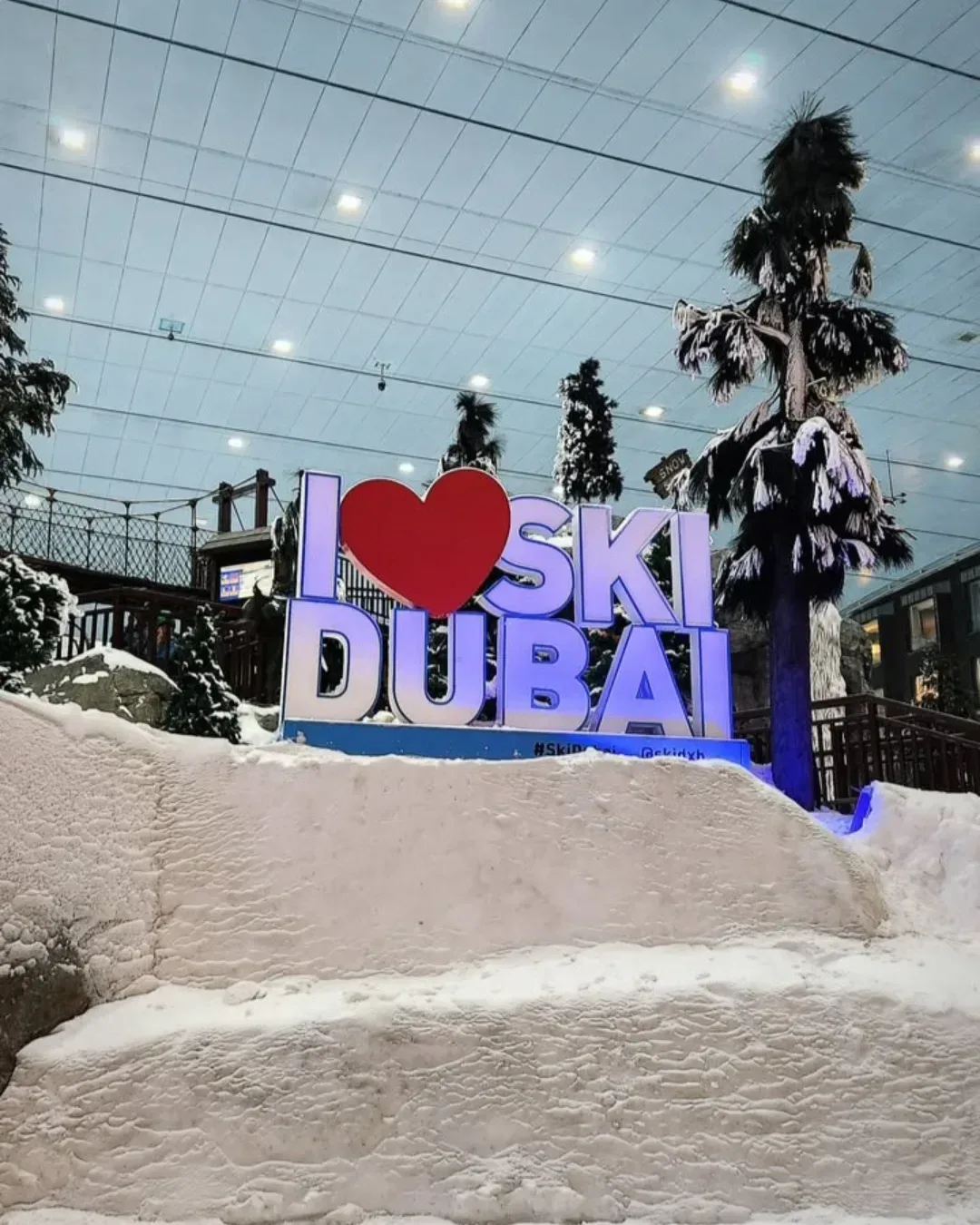 I Love Ski Dubai sign surrounded by snow at the indoor ski park