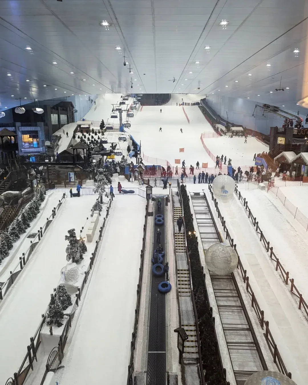 Ski Dubai indoor ski slope with chairlifts, snow activities and visitors