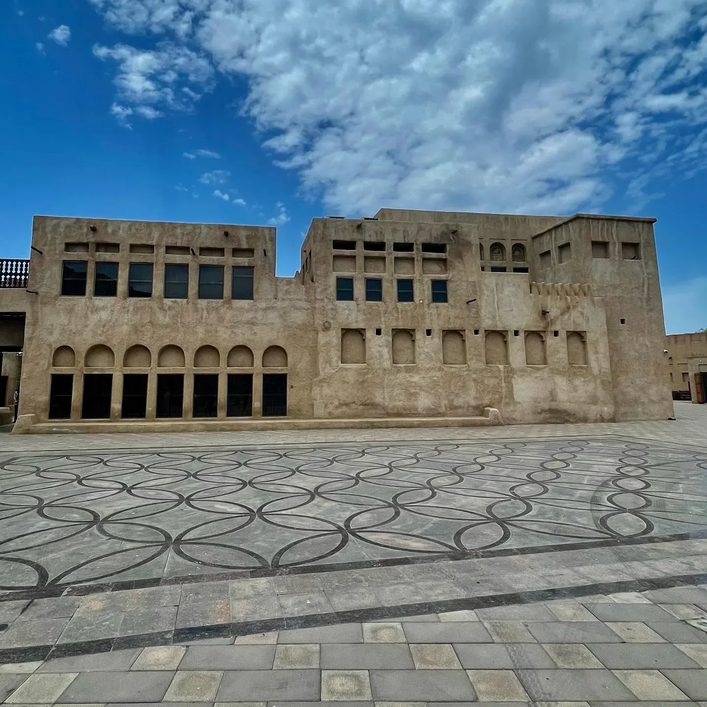 Traditional Al Shindagha Museum courtyard with historic Dubai architecture and patterned stone paving