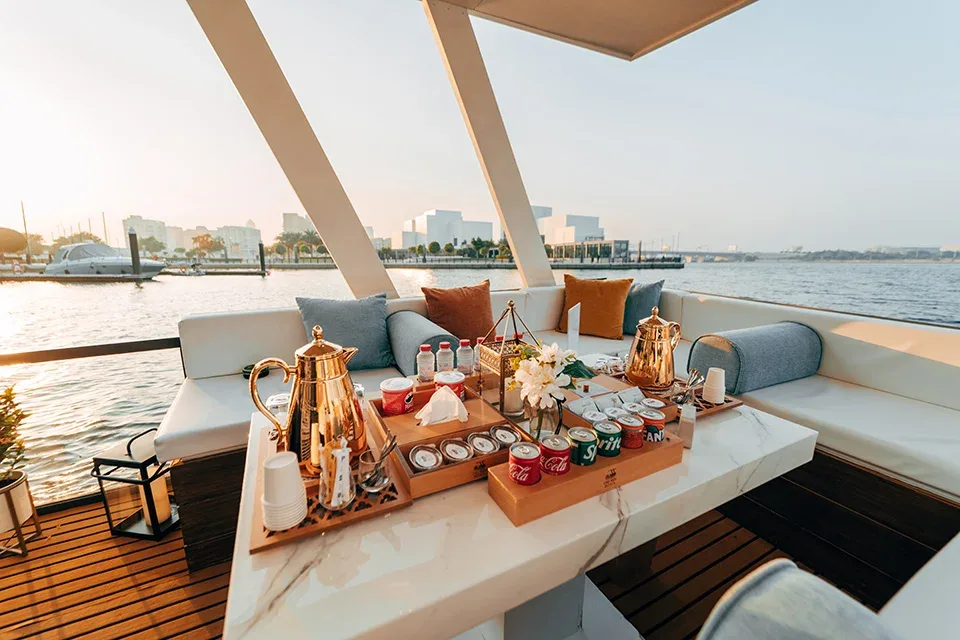 Interior of Dream Boats Floating Cafe with refreshments and seating overlooking Dubai waterfront