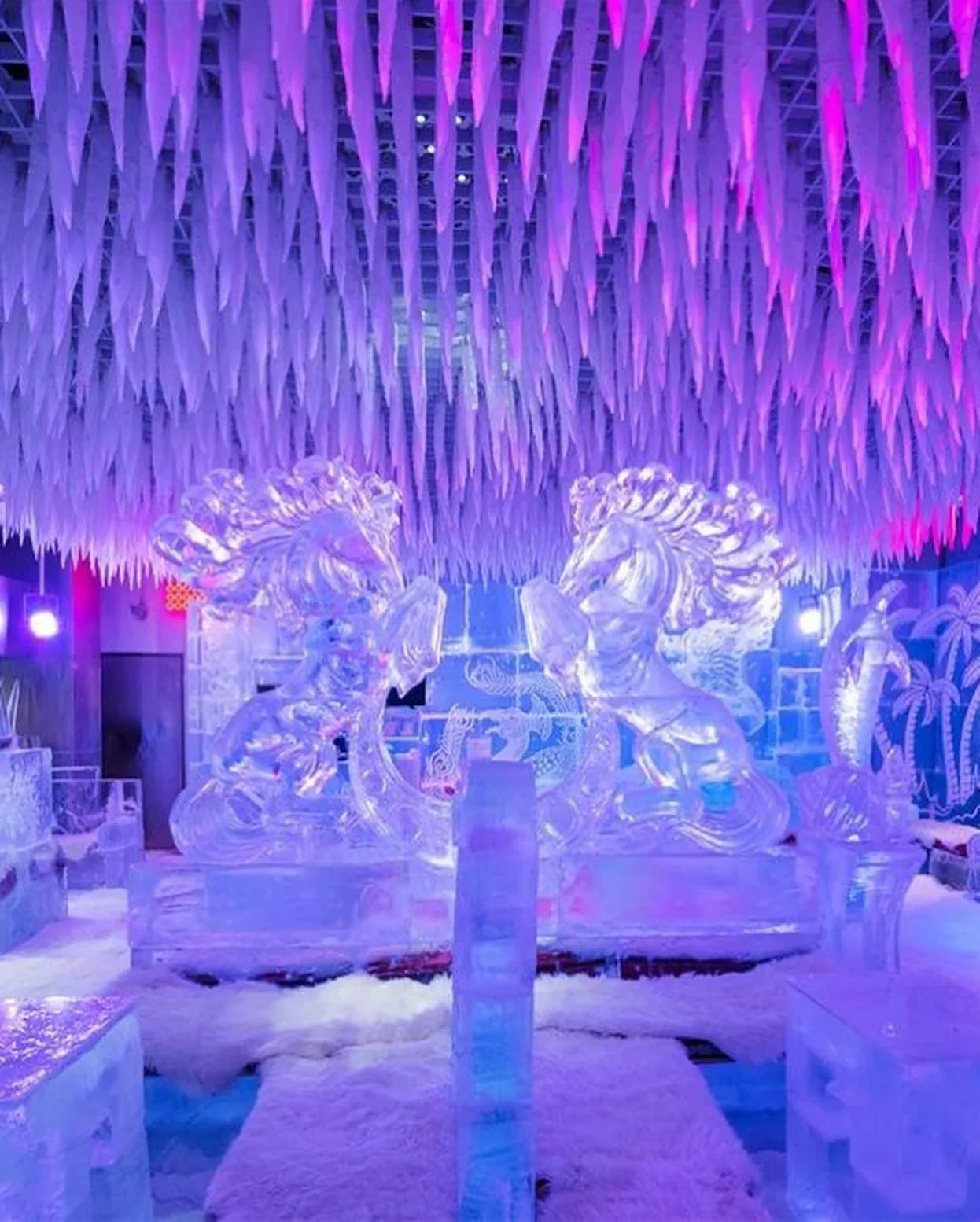 Colorful ice sculptures and frozen seating inside Chillout Ice Lounge Dubai
