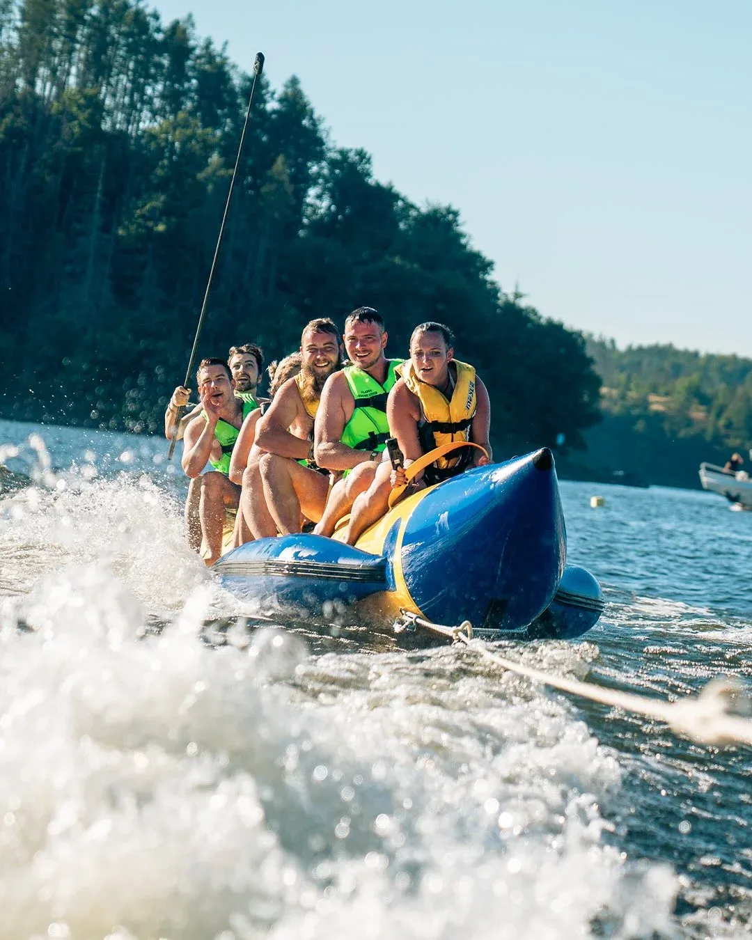 Group enjoying a thrilling banana boat ride on the water in Dubai
