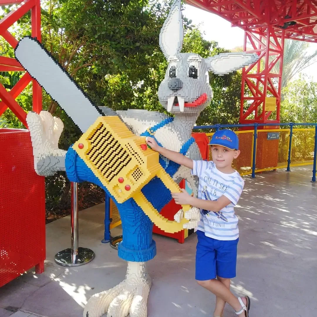 Child posing with LEGO model at LEGOLAND Dubai