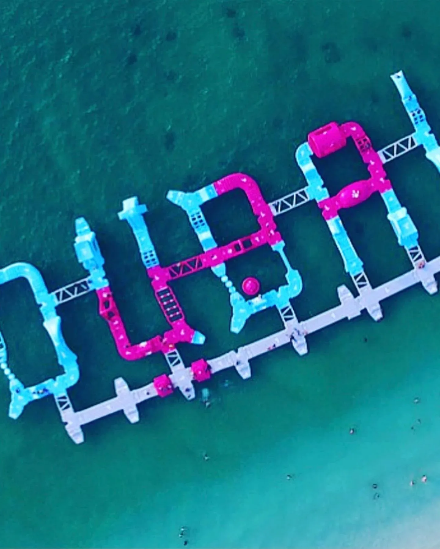 Aerial view of Aqua Fun Dubai floating inflatable obstacle course in the sea