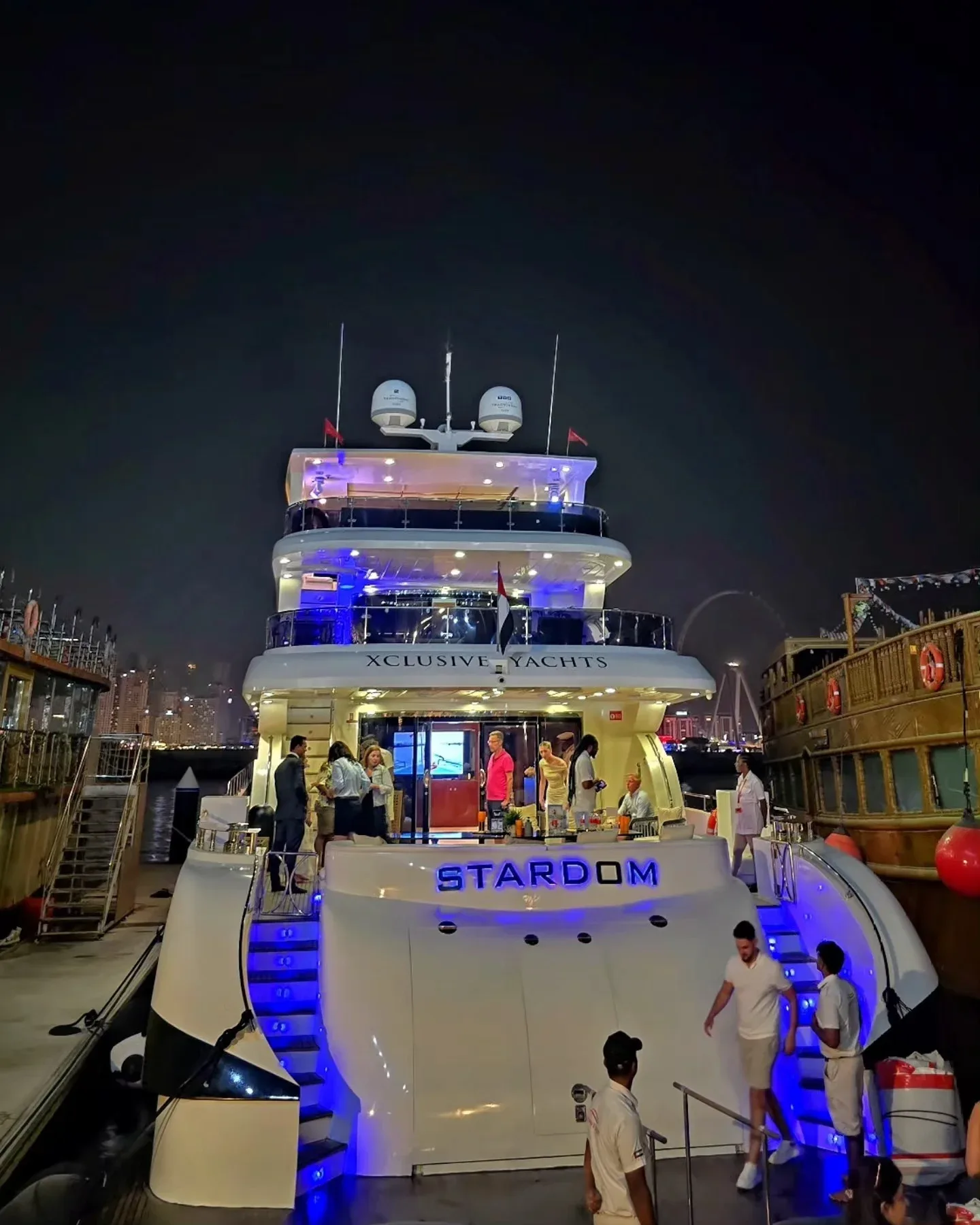 Xclusive yacht cruise Dubai at night with passengers onboard