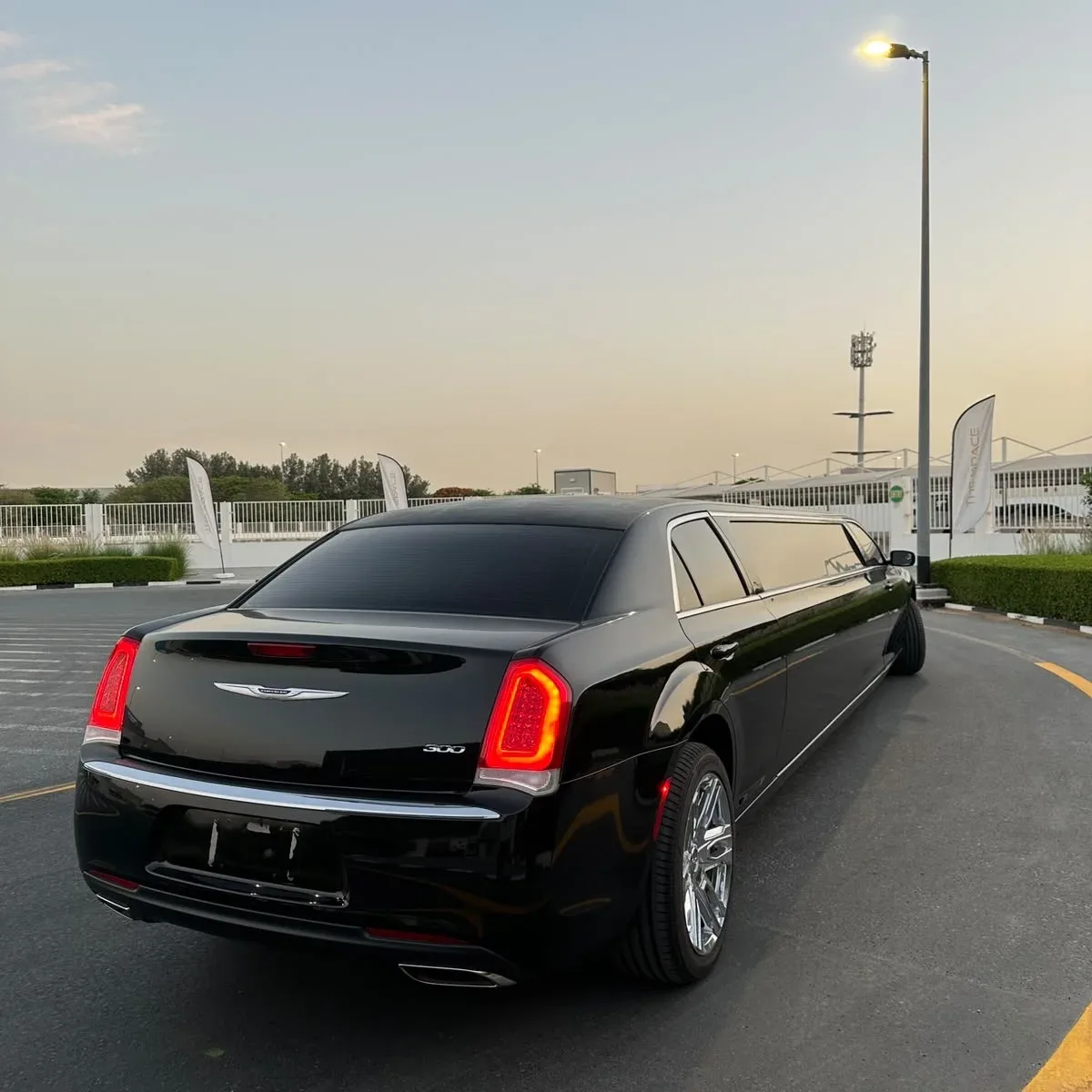 Rear view of a black luxury limousine parked in Dubai
