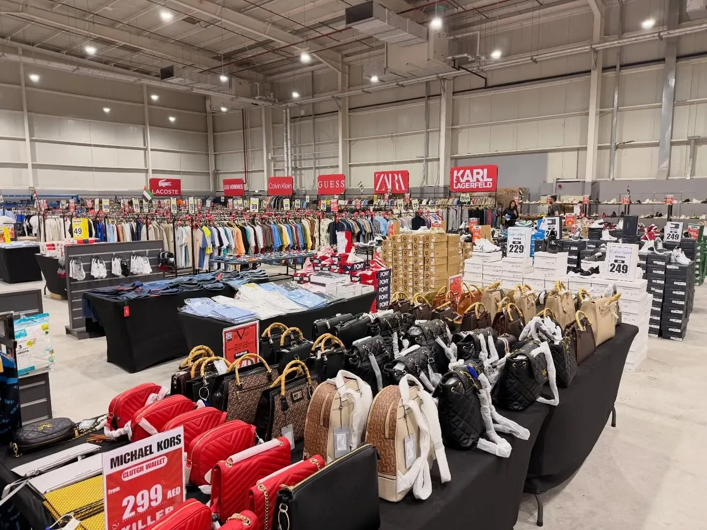 Dubai shopping market with clothing, shoes, handbags and fashion brands on display