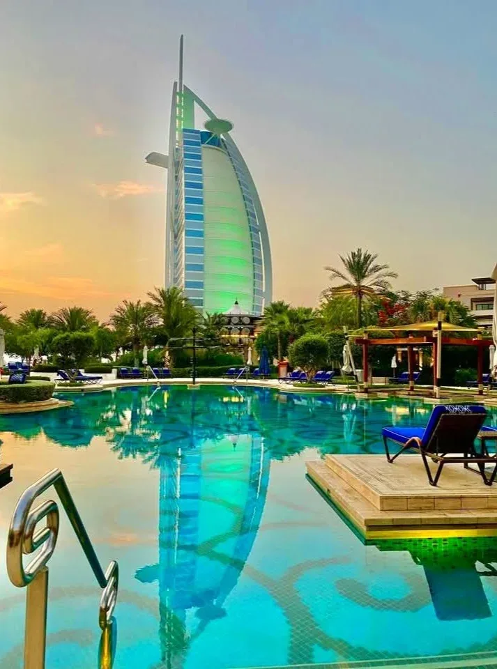 Luxury Dubai waterfront hotel with Palm Jumeirah villas and turquoise Arabian Gulf