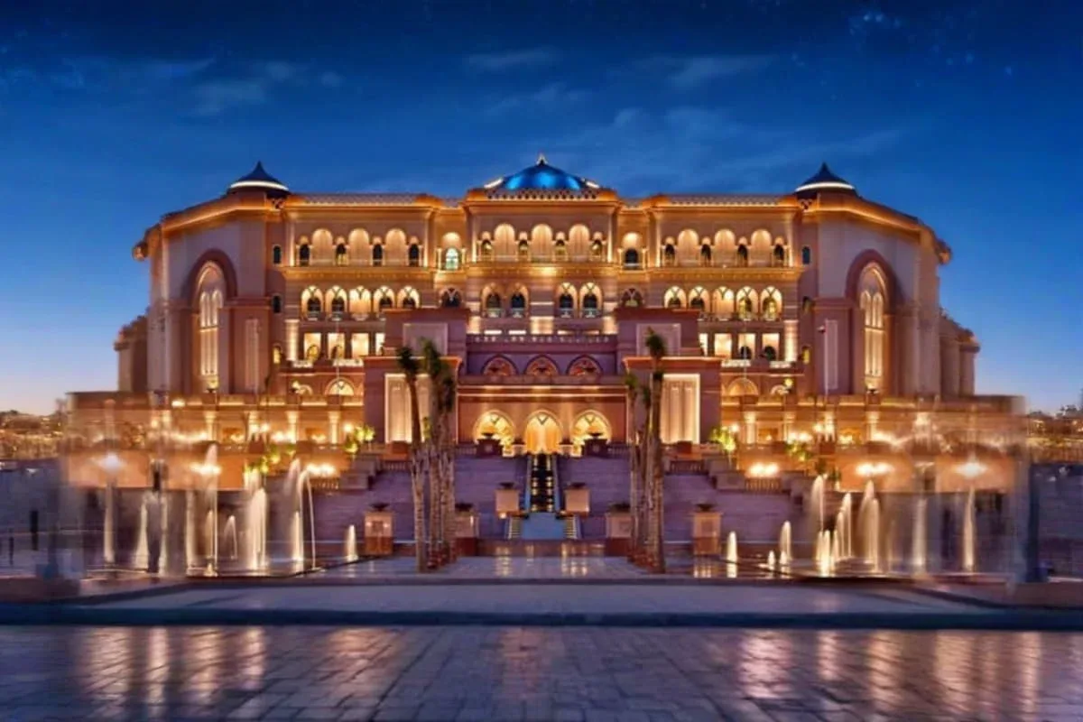Emirates Palace Abu Dhabi illuminated at night with fountains and grand architecture