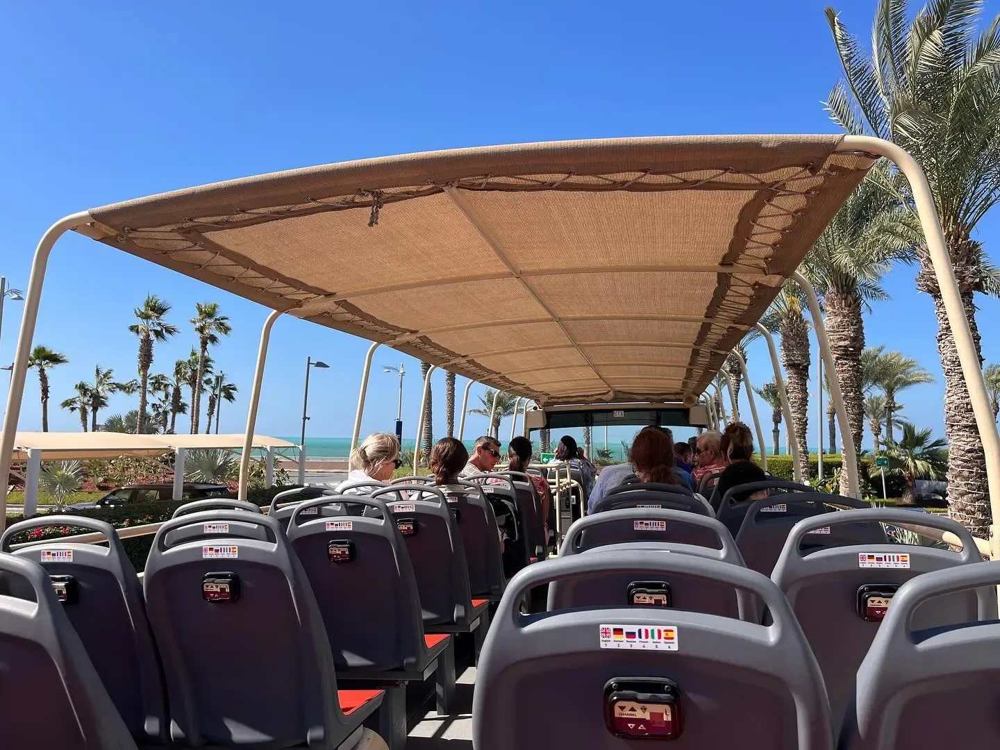 Big Bus Dubai passengers enjoying a coastal sightseeing route
